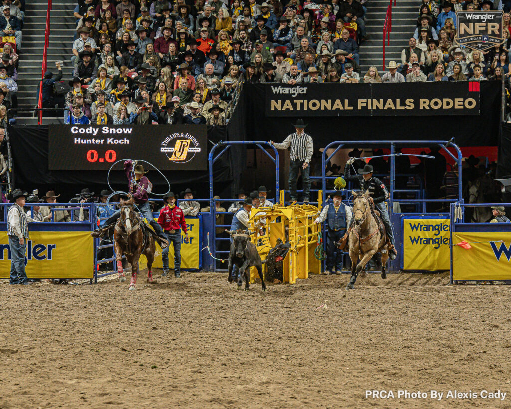 2019 Canadian Champion Heeler Hunter Koch, and his partner Cody Snow. WNFR Round 4. PRCA photo by Alexis Cady