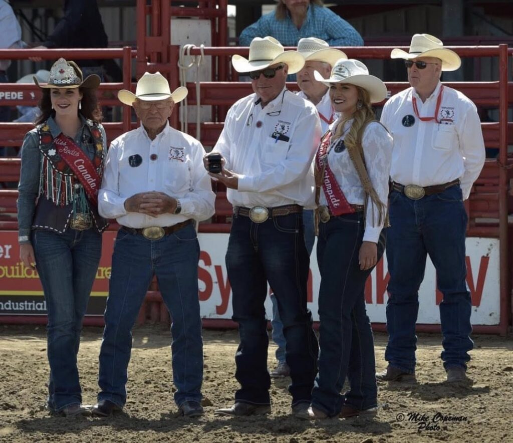 Frank Mickey, Blair Vold, Miss Rodeo Canada and Ponoka Board Members. Frank Mickey Hall of Fame induction

